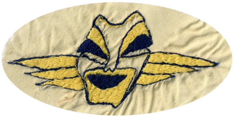 Le  masque rieur de la 6ième escadrille du GC III/6 brodé par Julienne BIBERT